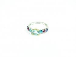 Silver and yellow gold ring with Blue Topaz Blue Topaz Central and 2, 2 and 2 iolites Rodolitas