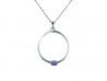 Silver pendant and yellow gold clasps holding Iolite.