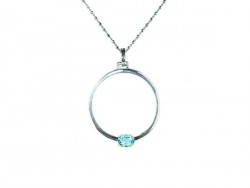 Silver pendant with yellow gold clasps holding Blue Topaz.