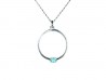 Silver pendant with yellow gold clasps holding Blue Topaz.