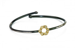 Rusty silver bracelet, yellow gold center and white diamonds.