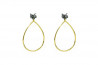 Long silver and gold earrings with black diamond.