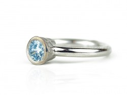 Silver ring with blue topaz.