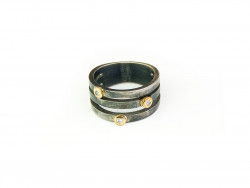 Ring in oxidized silver and 3 mouths in 750mm yellow gold and with 3 white brilliants.