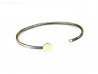 Polsera d'argent oxidat mat, oberta i combinada amb placa rodona i boca en or groc de 750 mm amb 1 brillant blanc.