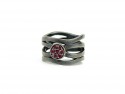 Silver and ruby ring.
