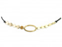 Necklace formed by center of matte vague and polished yellow gold plates, mounted with black cotton cord and gold clasp.