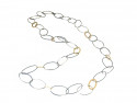 Collar llarg vagues d'argent setinades i 7 vagues d'or mat intercalades de dues mesures diferents. Mesura total 86cms.