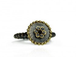 Silver ring and yellow gold with shiny black.