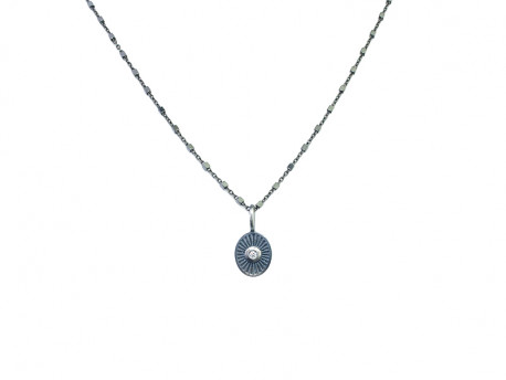 Oxidized and satin silver pendant of 925mm in oval shape with 1 natural brilliant of 0.02cts.