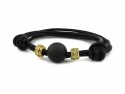 Leather bracelet, onyx and gold donuts.