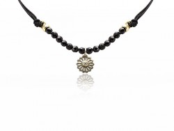 Silk necklace with onyx beads and silver flower pendant and shiny.