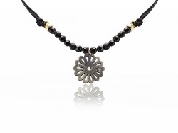 Silk necklace with onyx beads and silver flower pendant.