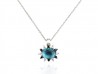 Gold pendant with blue topaz, bright whites and blacks.