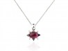 Gold pendant with rubellite, bright whites and blacks.