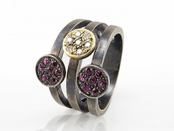 Silver ring and yellow gold with rubies and white diamonds.
