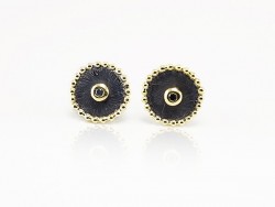 Silver and yellow gold earrings with black diamonds.